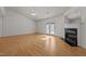 Bright living room featuring new floors, vaulted ceiling and glass doors that lead to the backyard at 3027 Maple Ave # U1, Burlington, NC 27215