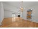 Open floor plan with hardwood floors connecting the living room and kitchen at 3027 Maple Ave # U1, Burlington, NC 27215
