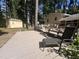 Backyard deck area featuring patio furniture and a shed in a wooded backyard at 3205 Broyhill Cir, Raleigh, NC 27604