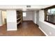 Finished basement boasts laminate flooring, built-in shelving, and neutral tones at 3205 Broyhill Cir, Raleigh, NC 27604