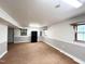 Finished basement featuring laminate flooring, natural light, and neutral paint at 3205 Broyhill Cir, Raleigh, NC 27604