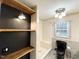 Bathroom featuring gray tiles, a black toilet, and a new-looking shower with shelves at 3205 Broyhill Cir, Raleigh, NC 27604