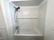 Clean bathroom features a tub with shower and modern subway tile surround at 3205 Broyhill Cir, Raleigh, NC 27604