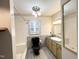 Bathroom featuring gray tile, a black toilet, a new-looking shower, and an olive vanity at 3205 Broyhill Cir, Raleigh, NC 27604
