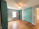 This bedroom features hardwood floors, built-in shelving, a ceiling fan, and ample closet space at 3205 Broyhill Cir, Raleigh, NC 27604