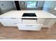 Spacious kitchen island features sleek countertop, modern cooktop, and ample storage drawers and cabinets at 3205 Broyhill Cir, Raleigh, NC 27604