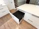 Kitchen island offers generous counter space and built-in storage cabinets, drawers, and waste bins at 3205 Broyhill Cir, Raleigh, NC 27604