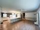 Expansive open layout with a kitchen island and a separate seating area, designed for effortless entertaining and modern living at 3205 Broyhill Cir, Raleigh, NC 27604