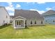 Spacious backyard with a covered patio perfect for outdoor entertaining and relaxation at 33 Black Walnut Dr # 185, Garner, NC 27529
