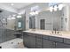 Modern bathroom features a double vanity, sleek fixtures, and a glass-enclosed shower at 33 Black Walnut Dr # 185, Garner, NC 27529