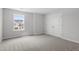 Light-filled bedroom offers ample closet space and a view of the surrounding neighborhood at 33 Black Walnut Dr # 185, Garner, NC 27529