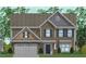Charming two-story house with stone accents, a covered entry, gable roof, and a two car garage at 33 Black Walnut Dr # 185, Garner, NC 27529