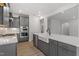 Modern kitchen with gray cabinets, stainless steel appliances, and a farmhouse sink at 33 Black Walnut Dr # 185, Garner, NC 27529