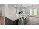 Kitchen island with undermount sink overlooking the living room at 33 Black Walnut Dr # 185, Garner, NC 27529