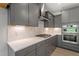 Modern kitchen with gray cabinets, stainless steel appliances, and a stylish backsplash at 33 Black Walnut Dr # 185, Garner, NC 27529