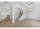 Open-concept home with a light fixture in the living room and an arched entryway at 33 Black Walnut Dr # 185, Garner, NC 27529