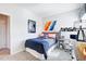 Cozy bedroom featuring a neatly made bed with colorful art and decor for a youthful feel at 334 Deodora Ln, Cameron, NC 28326