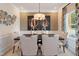 Sophisticated dining room with a stylish table, decorative art, and patterned curtains at 334 Deodora Ln, Cameron, NC 28326