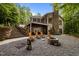 Home with backyard featuring a fire pit, wooden chairs and stone staircase at 343 Lakewood Pointe Dr, Roxboro, NC 27574