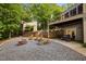 Backyard offers fire pit, outdoor furniture, and a stone staircase to a deck at 343 Lakewood Pointe Dr, Roxboro, NC 27574
