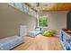 Bright bonus room features wood floors, twin beds and large windows offering scenic views at 343 Lakewood Pointe Dr, Roxboro, NC 27574