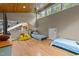 This bonus room is spacious and bright with wood floors and a vaulted wood ceiling at 343 Lakewood Pointe Dr, Roxboro, NC 27574