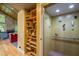 Interior elevator with custom woodwork and shelving at 343 Lakewood Pointe Dr, Roxboro, NC 27574