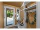Welcoming entryway featuring a bench, coat rack, tile floors and access to the outdoors at 343 Lakewood Pointe Dr, Roxboro, NC 27574