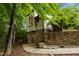 Two-story detached studio with stone base in wooded area at 343 Lakewood Pointe Dr, Roxboro, NC 27574