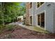 Home exterior with stone chimney, patio, and detached studio at 343 Lakewood Pointe Dr, Roxboro, NC 27574
