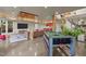 Large game room featuring a leather sectional, pool table and indoor plants at 343 Lakewood Pointe Dr, Roxboro, NC 27574