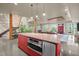 An open concept room showcases a red kitchen island with stainless steel appliances at 343 Lakewood Pointe Dr, Roxboro, NC 27574