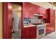 Well-equipped kitchen with modern appliances, custom wood cabinetry, designer tile backsplash and open layout at 343 Lakewood Pointe Dr, Roxboro, NC 27574