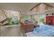 Spacious living room with a comfortable leather sectional, a fireplace and ample natural light at 343 Lakewood Pointe Dr, Roxboro, NC 27574