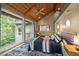 This main bedroom has a vaulted wood ceiling, large windows, and a view to the backyard at 343 Lakewood Pointe Dr, Roxboro, NC 27574