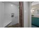 Walk-in shower with pebble floor, tiled walls and a shower bench at 343 Lakewood Pointe Dr, Roxboro, NC 27574