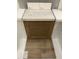 Material samples showcasing cabinet, countertop, backsplash, and flooring options for kitchen or bathroom at 355 Chesapeake Cmns St # 112, Garner, NC 27529