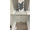 Selections of materials include blue glass tile, light countertop, white cabinets, and matching flooring at 367 Chesapeake Cmns St # 115, Garner, NC 27529