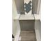 Selections of materials include blue glass tile, gray cabinets, light countertop, and matching flooring at 367 Chesapeake Cmns St # 115, Garner, NC 27529