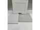 A selection of design materials includes white cabinetry and coordinating floor tiles at 367 Chesapeake Cmns St # 115, Garner, NC 27529