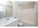Bathroom featuring a shower and bathtub combination with a large mirror over the sink at 4009 Patriot Ridge Ct, Raleigh, NC 27610