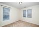 Bright bedroom featuring two windows and neutral carpeting at 4009 Patriot Ridge Ct, Raleigh, NC 27610