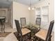 Dining room with glass table and neutral color scheme at 4009 Patriot Ridge Ct, Raleigh, NC 27610
