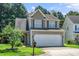Charming two-story home with a two-car garage and well-maintained landscaping at 4009 Patriot Ridge Ct, Raleigh, NC 27610