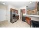 Kitchen with stainless steel refrigerator and breakfast bar at 4009 Patriot Ridge Ct, Raleigh, NC 27610
