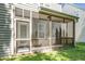 Cozy screened porch with wood railing offers comfortable outdoor living at 4009 Patriot Ridge Ct, Raleigh, NC 27610