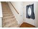 Carpeted staircase with wooden handrail at 4009 Patriot Ridge Ct, Raleigh, NC 27610