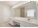 Spacious bathroom with double vanity, and large mirror accented by Hollywood-style lighting at 402 Halls Mill Dr, Cary, NC 27519