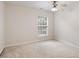 Cozy bedroom with plush carpeting and a bright window at 402 Halls Mill Dr, Cary, NC 27519