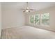 Spacious bedroom with vaulted ceilings, neutral carpet and plenty of natural light from three windows at 402 Halls Mill Dr, Cary, NC 27519